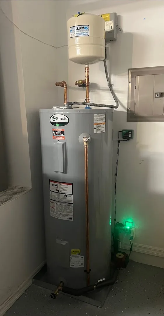 A.O. Smith electric water heater with expansion tank and People's Choice Plumbing sticker