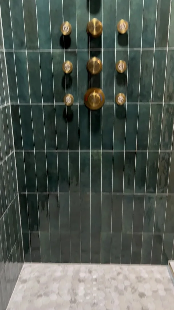 Green-tile shower with six-jet brass body-spray system